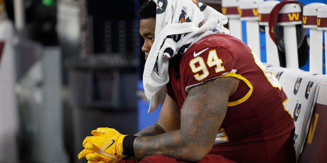 Washington Football Team defensive tackle Daron Payne sits on the bench in the second half of an NFL football game against the Dallas Cowboys in Arlington, Texas, Sunday, Dec. 26, 2021.