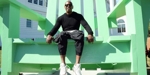 Dave Chappelle sits in the big green chair, a landmark on the campus of the Duke Ellington School of the Arts on September 29, 2017, in Washington, D.C.