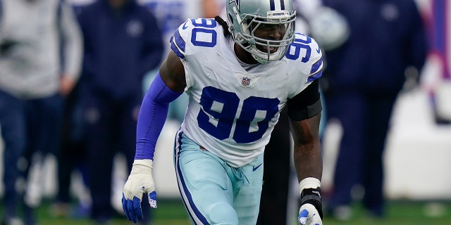 Dallas Cowboys defensive end Demarcus Lawrence (90) reacts after a defensive play against the New York Giants during the fourth quarter of an NFL football game, Sunday, Dec. 19, 2021, in East Rutherford, N.J.