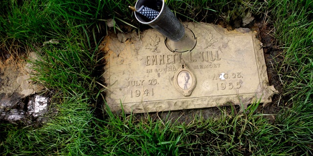 The mud-caked grave marker for 14-year-old Emmett Till, whose murder in Mississippi in 1955 is considered one of the events that accelerated the Civil Rights Movement, on May 5, 2009, in Burr Oak Cemetery in Alsip, Ill. 