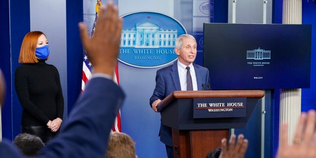 Dr. Anthony Fauci, director of the National Institute of Allergy and Infectious Diseases, speaks during the daily briefing at the White House in Washington, Wednesday, Dec. 1, 2021, as White House press secretary Jen Psaki watches. (AP Photo/Susan Walsh) 