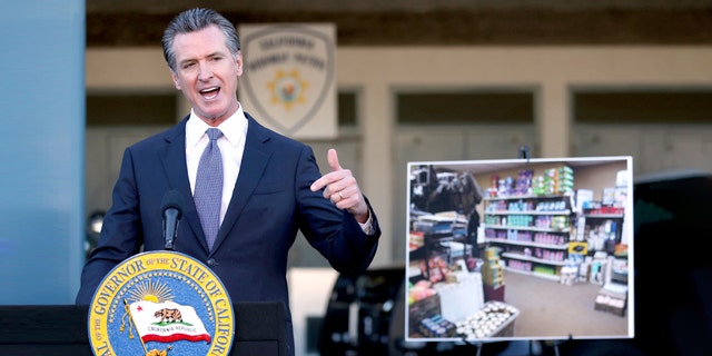 California Gov. Gavin Newsom speaks Friday, Dec. 17, 2021, at a news conference in Dublin, Calif. Stung by recent headline-grabbing smash-and-grab robberies at high-end stores, Newsom said that he will seek more than 0 million over three years to boost law enforcement efforts on retail theft, while also targeting increasing gun violence. 