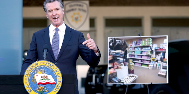 California Gov. Gavin Newsom speaks Friday, Dec. 17, 2021, at a news conference in Dublin, Calif. Stung by recent headline-grabbing smash-and-grab robberies at high-end stores, Newsom said that he will seek more than $300 million over three years to boost law enforcement efforts on retail theft, while also targeting increasing gun violence.