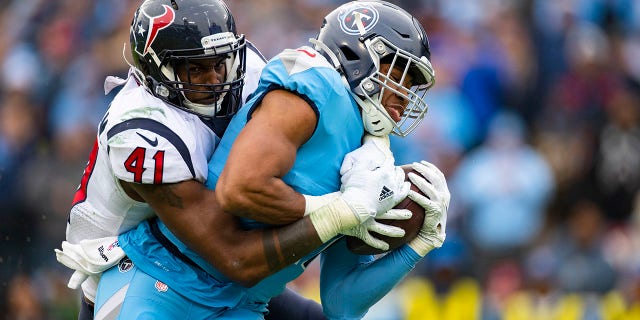 Zach Cunningham (41) of the Houston Texans tackles Khari Blasingame of the Tennessee Titans short of the goal line during the third quarter at Nissan Stadium on Dec. 15, 2019 in Nashville, Tenn.