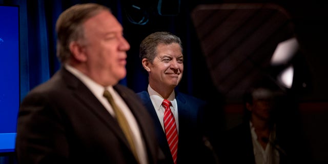 Secretary of State Mike Pompeo, accompanied by Sam Brownback, ambassador at large for international religious freedom, speaks during a news conference at the State Department in Washington, D.C., on June 10, 2020. (ANDREW HARNIK/POOL/AFP via Getty Images)