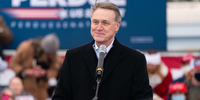 FILE - Then-Sen. David Perdue speaks at a Defend The Majority campaign event attended by former Vice President Mike Pence on Dec. 17, 2020, in Columbus, Georgia.