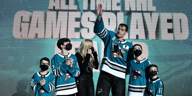Patrick Marleau # 12 of the San Jose Sharks and his family waves to the audience as he is honored to have passed Gordie Howe on the NHL's list of all game play before the game against the Minnesota Wild at the SAP Center on April 24, 2021 in San Jose, California .