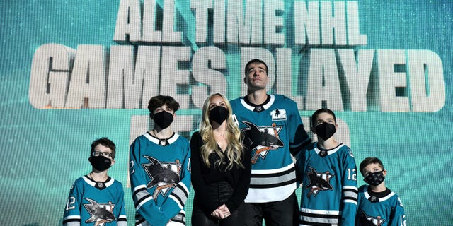 Patrick Marleau of the San Jose Sharks and his family look up at the video board as he is honored for having passed Gordie Howe on the NHL's all-time games played list before the game against the Minnesota Wild at SAP Center on April 24, 2021, in San Jose, California.
