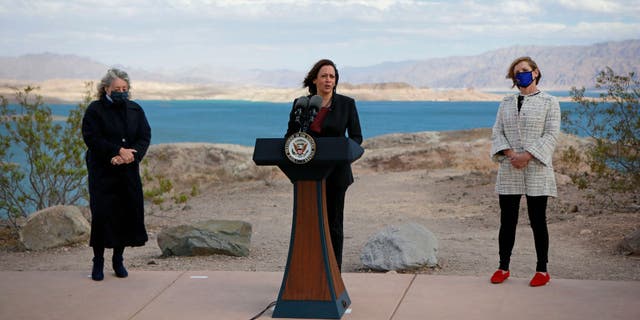 Reps. Dina Titus and Susie Lee listen as Vice President Kamala Harris speaks to the media at Lake Mead National Recreation Area on Oct. 18, 2021, in Boulder City, Nevada. 