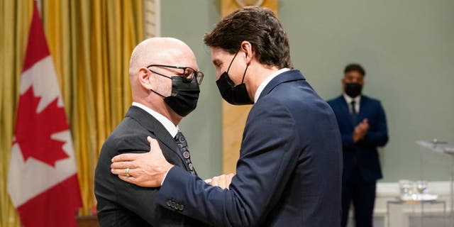 Canada's Prime Minister Justin Trudeau speaks with Minister of Justice and Attorney General of Canada David Lametti during the swearing-in of the 29th Canadian Ministry at Rideau Hall in Ottawa, on Oct., 26, 2021. (ADRIAN WYLD/POOL/AFP via Getty Images)