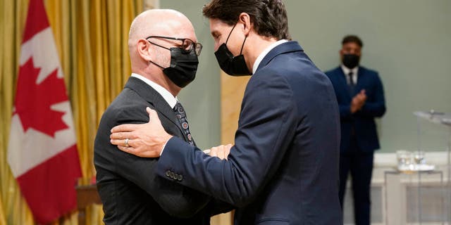 Canada's Prime Minister Justin Trudeau speaks with Minister of Justice and Attorney General of Canada David Lametti during the swearing-in of the 29th Canadian Ministry at Rideau Hall in Ottawa, on Oct., 26, 2021. (ADRIAN WYLD/POOL/AFP via Getty Images)