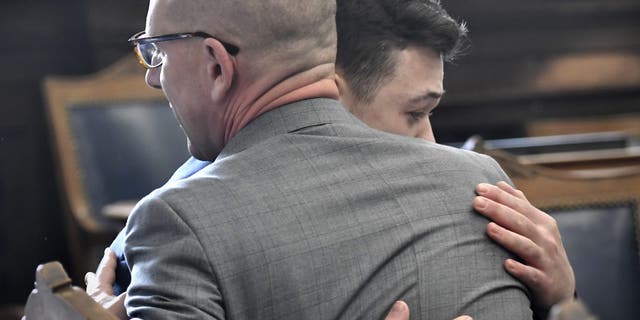 Kyle Rittenhouse hugs one of his attorneys, Corey Chirafisi, after he is found not guilty in his trial at the Kenosha County Courthouse on November 19, 2021 in Kenosha, Wisconsin.  (Photo by Sean Krajacic - Pool/Getty Images)