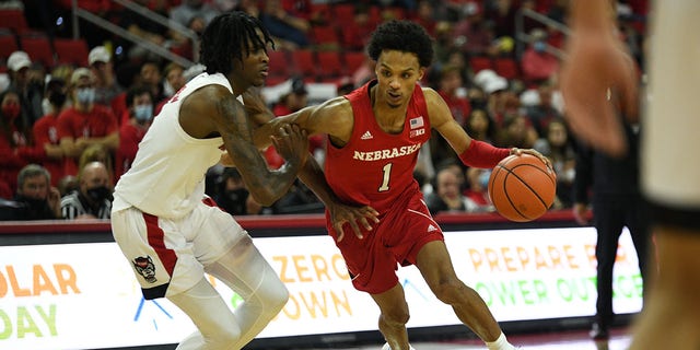 Nebraska Cornhuskers guard Alonzo Verge Jr. (1) drives on North Carolina State Wolfpack guard Dereon Seabron (1) during the game between the North Carolina State Wolfpack and the Nebraska Cornhuskers at PNC Arena on December 1, 2021 in Raleigh, NC.