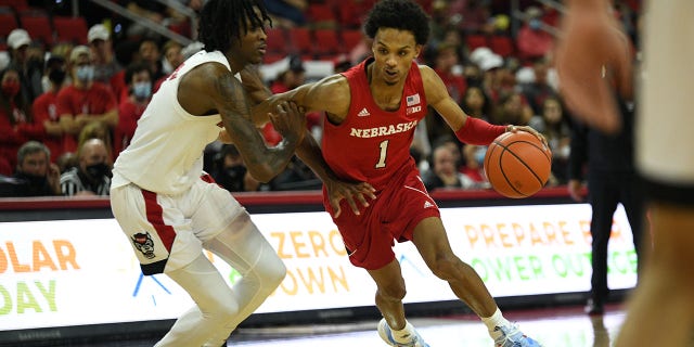 Nebraska Cornhuskers guard Alonzo Verge Jr. (1) drives on North Carolina State Wolfpack guard Dereon Seabron (1) during the game between the North Carolina State Wolfpack and the Nebraska Cornhuskers at PNC Arena on December 1, 2021 in Raleigh, NC.