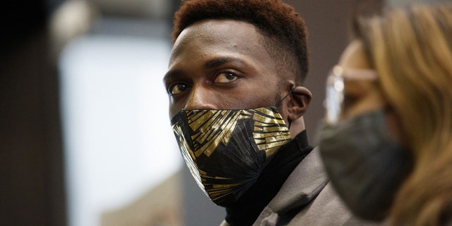 Abimbola 'Abel' Osundairo, one of the brothers connected to the alleged staged hate crime involving Jussie Smollett, and his attorney Gloria Schmidt Rodriguez walk through the Leighton Criminal Courthouse on Dec. 1, 2021. (Armando L. Sanchez/Chicago Tribune/Tribune News Service via Getty Images)