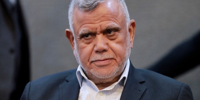 Hadi al-Amiri, head of the Fatah Alliance, looks on during a press conference in Iraq's capital Baghdad on Dec. 4, 2021.
