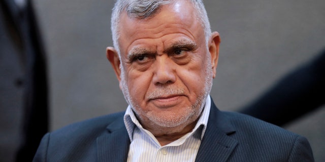 Hadi al-Amiri, head of the Fatah Alliance, looks on during a press conference in Iraq's capital Baghdad on Dec. 4, 2021. 