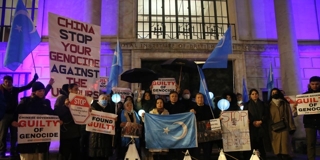 People protest outside the Chinese embassy after the Uyghur tribunal ruled that China committed genocide of Uyghurs and other ethnic minorities through measures such as forced birth control and sterilization on December 9, 2021 in London, UK.  (Hasan Esen / Anadolu Agency via Getty Images)