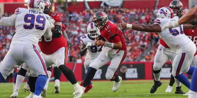 Buccaneers quarterback Tom Brady runs for a first down against the Buffalo Bills  on Dec. 12, 2021, at Raymond James Stadium in Tampa, Florida. 