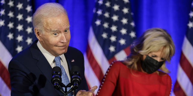 President Biden points to First Lady Jill Biden at DNC holiday party in Washington, D.C., on Tuesday, Dec. 14, 2021. (Oliver Contreras/Sipa/Bloomberg via Getty Images)