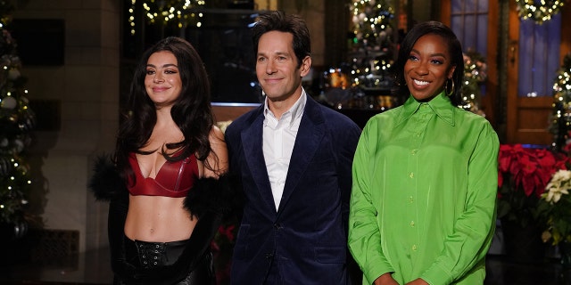 Scheduled musical guest Charli XCX, left, host Paul Rudd, and "SNL" cast member Ego Nwodim record promos for the show in New York City, Dec. 16, 2021. Charli XCX was later forced to cancel her performance due to coronavirus-related crew-member absences.