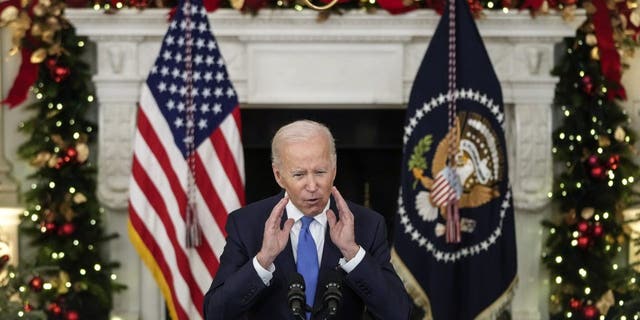 President Joe Biden speaks about the omicron variant of the coronavirus in the State Dining Room of the White House. 