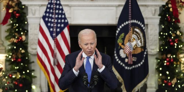 President Joe Biden speaks about the omicron variant of the coronavirus in the State Dining Room of the White House.