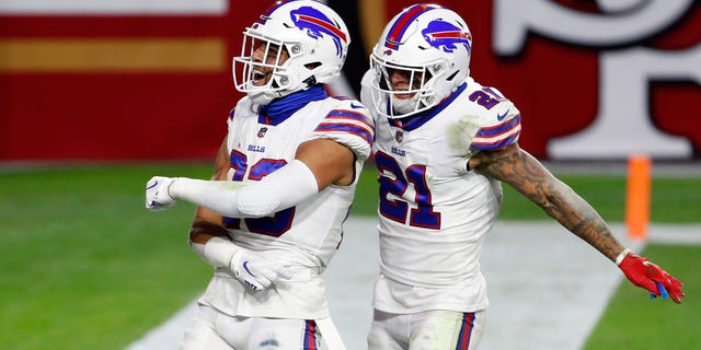 GLENDALE, ARIZONA - DECEMBER 07: Safety Micah Hyde #23 of the Buffalo Bills celebrates his interception against the San Francisco 49ers with teammate Jordan Poyer #21 of the Bills during the second half of the NFL football game at State Farm Stadium on December 07, 2020 in Glendale, Arizona.