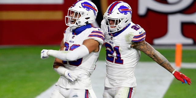 GLENDALE, ARIZONA - DECEMBER 07: Safety Micah Hyde #23 of the Buffalo Bills celebrates his interception against the San Francisco 49ers with teammate Jordan Poyer #21 of the Bills during the second half of the NFL football game at State Farm Stadium on December 07, 2020 in Glendale, Arizona. 