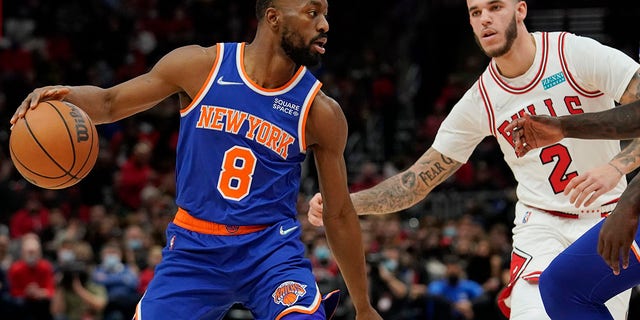 CHICAGO, ILLINOIS - NOVEMBER 21: Kemba Walker #8 of the New York Knicks dribbles the ball against Lonzo Ball #2 of the Chicago Bulls in the first half at United Center on November 21, 2021 in Chicago, Illinois.