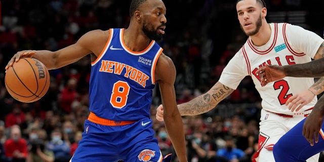 CHICAGO, ILLINOIS - NOVEMBER 21: Kemba Walker #8 of the New York Knicks dribbles the ball against Lonzo Ball #2 of the Chicago Bulls in the first half at United Center on November 21, 2021 in Chicago, Illinois.