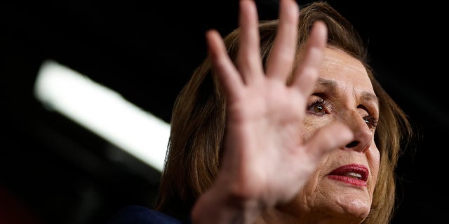 House Speaker Nancy Pelosi talks to reporters during her weekly news conference in the U.S. Capitol Visitors Center. 