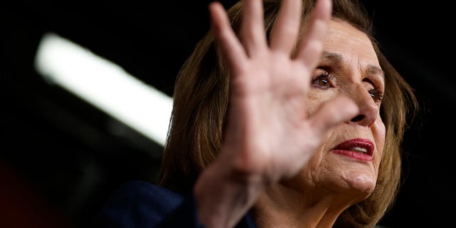 House Speaker Nancy Pelosi talks to reporters during her weekly news conference in the U.S. Capitol Visitors Center.