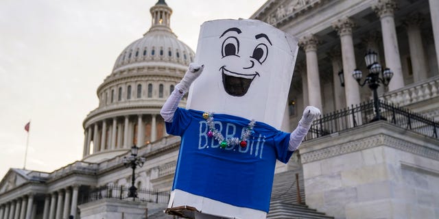MoveOn supporters and students attend a sit-in for a Build Back Better "Jingle back better" action on the steps of the Senate of the United States Capitol on December 15, 2021 in Washington, DC (Leigh Vogel / Getty Images for MoveOn)