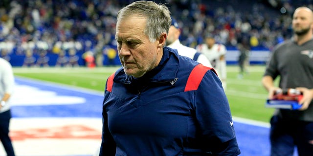 Head coach Bill Belichick of the New England Patriots walks off the field after a loss to the Indianapolis Colts at Lucas Oil Stadium on Dec. 18, 2021 in Indianapolis, Indiana. 