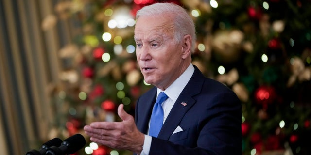 President Biden speaks about the omicron variant of the coronavirus in the State Dining Room of the White House, Dec. 21, 2021, in Washington, D.C.