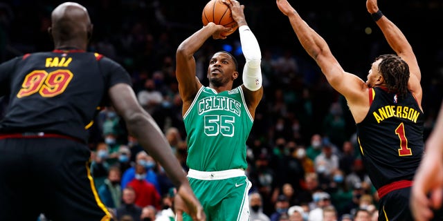 Justin Anderson #1 of the Cleveland Cavaliers attempts to block Joe Johnson #55 of the Boston Celtics shot during the fourth quarter of the game against the Cleveland Cavaliers at TD Garden on Dec. 22, 2021 in Boston, Massachusetts.