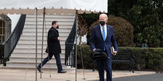 President Biden walks to speak with reporters on the South Lawn before departing from the White House on Marine One on Dec. 27, 2021 in Washington. (Photo by Anna Moneymaker/Getty Images)