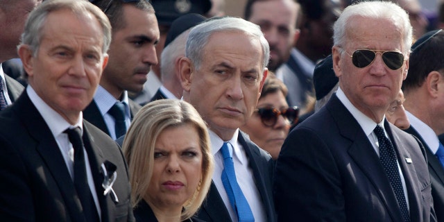 Then-US Vice President Joe Biden, right, and Israeli Prime Minister Benjamin Netanyahu and his wife Sara, center, and Former British Prime Minister Tony Blair, left, during a state memorial service for Israel's former Prime Minister Ariel Sharon at Israel's parliament, the Knesset on Jan. 13, 2014, in Jerusalem.