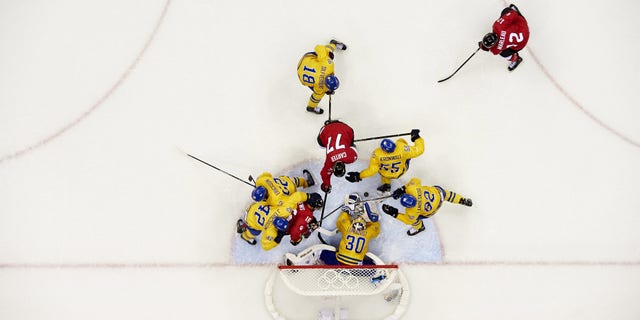 Hockey: 2014 Winter Olympics: Aerial view of Canada Jonathan Toews (16) and Jeff Carter (77) in action vs Sweden goalie Henrik Lundqvist (30) during Men's Gold Medal Game at Bolshoy Ice Dome. Sochi, Russia 2/23/2014