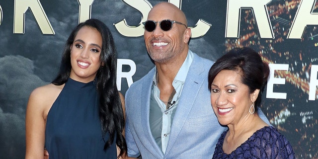 Dwayne Johnson (center) with his eldest daughter Simone Garcia Johnson (left) and his mother Ata Johnson (right).
