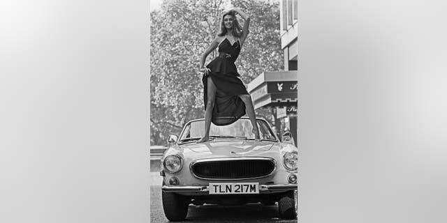 English model and actress Marilyn Cole poses outside the Playboy Club on Curzon Street in London, U.K., circa 1973.