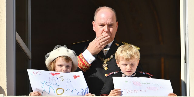 Prince Albert II of Monaco with his children Princess Gabriella of Monaco and Prince Jacques of Monaco appear on the balcony of the Palace during Monaco's National Day celebrations on November 19, 2021 in Monte-Carlo, Monaco.