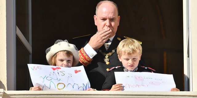 Prince Albert II of Monaco with his children Princess Gabriella of Monaco and Prince Jacques of Monaco at the palace balcony during the Monaco National Day Celebrations on November 19, 2021, in Monte-Carlo, Monaco.