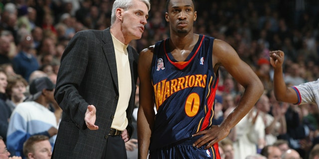 22 Jan 2002: Guard Gilbert Arenas #0 of the Golden State Warriors listens to Brian Winters during the NBA game against the Milwaukee Bucks at the Bradley Center in Milwaukee, Wisconsin. The Bucks won 116-112.