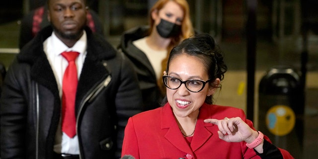 Attorney Gloria Schmidt Rodriguez, center, representing Ola Osundairo, left, talks to reporters in the Leighton Criminal Courthouse lobby Dec. 9, 2021, in Chicago, after a jury found actor Jussie Smollett guilty on five of six charges he staged a racist, anti-gay attack on himself and lied to police about it. 