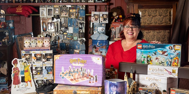 Nicol-Lewis' collection – which includes a collection of 47 wands, special edition books, LEGO sets, artwork and at least 127 action figures – takes up three rooms in her house. (SWNS) 