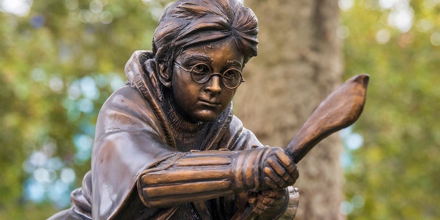 A new statue of Harry Potter in Leicester Square, London which has joined the eight other movie statues already on display.