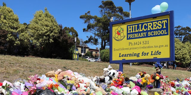 Flowers and tributes are seen outside Hillcrest Primary School in Devonport, Tasmania, Australia December 17, 2021. Australian police on Friday said investigations were continuing into the deaths of five children after a jumping castle was lifted into the air from strong winds at the school’s end-of-year celebration, including if it was properly tied to the ground. AAP Image/Ethan James via REUTERS  ATTENTION EDITORS - THIS IMAGE WAS PROVIDED BY A THIRD PARTY. NO RESALES. NO ARCHIVE. AUSTRALIA OUT. NEW ZEALAND OUT