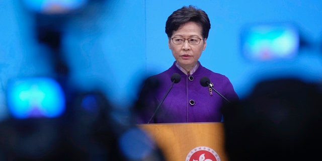 Hong Kong Chief Executive Carrie Lam listens to reporters' questions during a press conference in Hong Kong, Monday, Dec. 20, 2021.